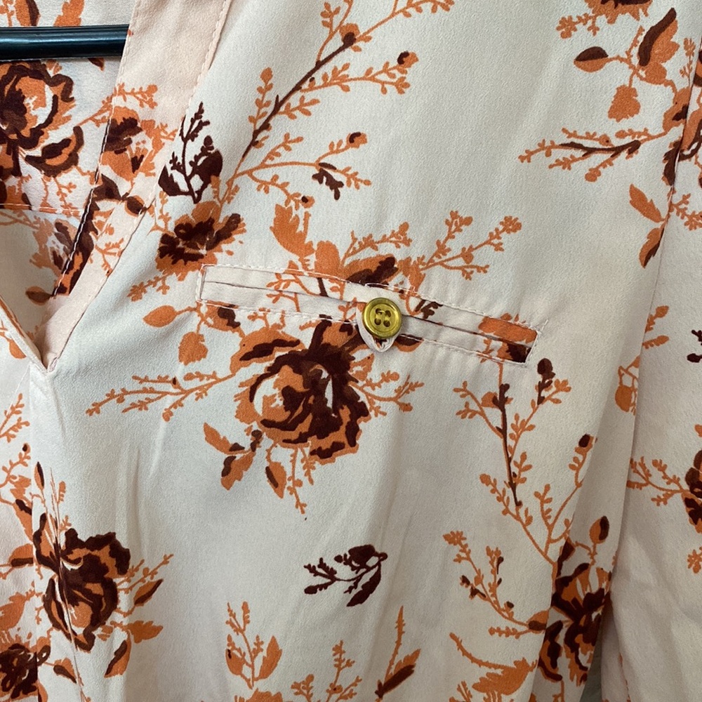 Light pink top with orange/maroon flowers, medium